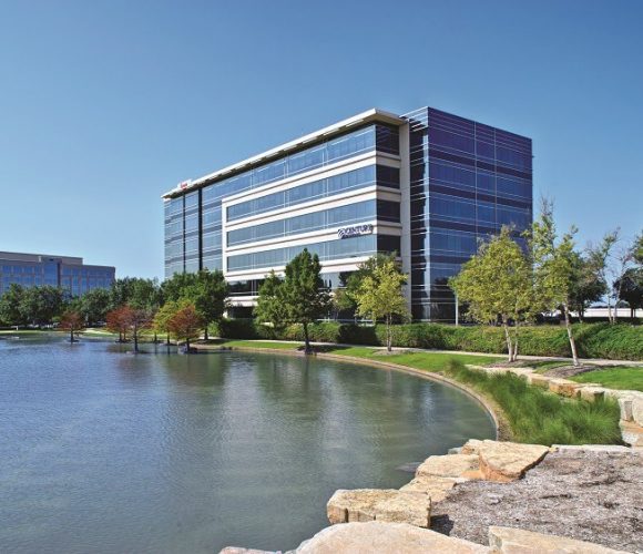 Hall Park office building in front of pond