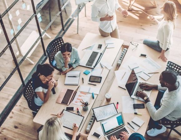 Group of people collaborating and working.